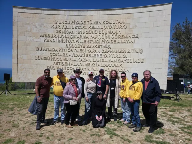 A tour group beside the commemorative wall at Chunuk Bair, Gallipoli.