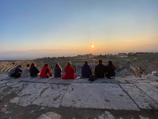 Travellers sharing a sunset stop at Mount Nemrut.