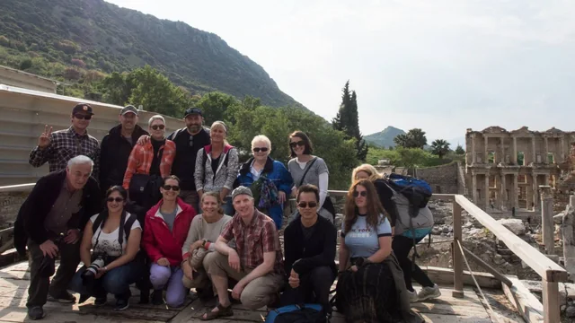 Travellers gathered on a walkway overlooking the Library of Celsus at Ephesus.