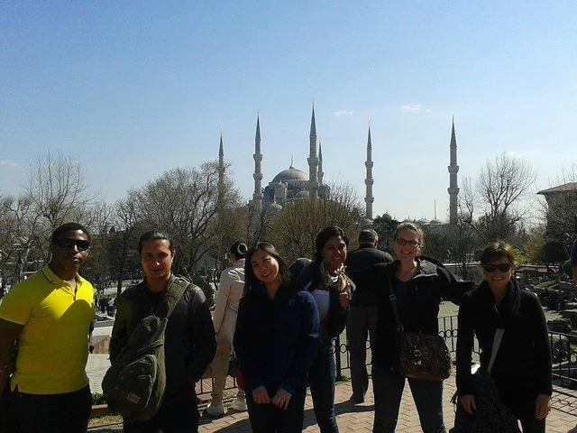 Travellers gathered in Sultanahmet with the Blue Mosque behind them.
